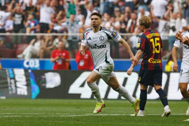 Rubne Vinagre, Legia Warszawa ve Pogon Szczecin (Maciej Rogowski) takımları arasında oynanan 2025 Polonya Kupası finalinde gol attıktan sonra kutlama yaparken görüldü.)