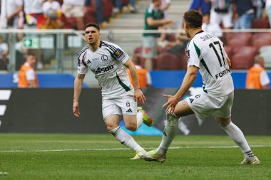 Rubne Vinagre, Legia Warszawa ve Pogon Szczecin (Maciej Rogowski) takımları arasında oynanan 2025 Polonya Kupası finalinde gol attıktan sonra kutlama yaparken görüldü.)