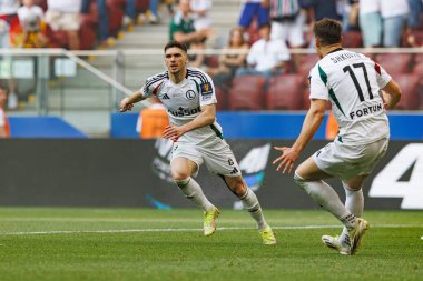 Rubne Vinagre, Legia Warszawa ve Pogon Szczecin (Maciej Rogowski) takımları arasında oynanan 2025 Polonya Kupası finalinde gol attıktan sonra kutlama yaparken görüldü.)