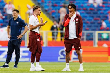 Polonya ve Moldova milli takımları arasında oynanan uluslararası dostluk maçı sırasında Matty Cash ve Maximilian Oyedele (Maciej Rogowski)