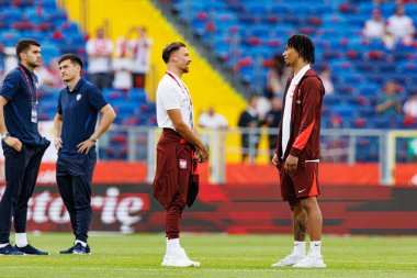Polonya ve Moldova milli takımları arasında oynanan uluslararası dostluk maçı sırasında Matty Cash ve Maximilian Oyedele (Maciej Rogowski)