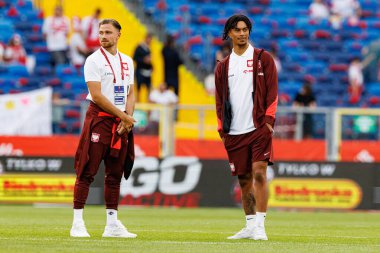 Polonya ve Moldova milli takımları arasında oynanan uluslararası dostluk maçı sırasında Matty Cash ve Maximilian Oyedele (Maciej Rogowski)