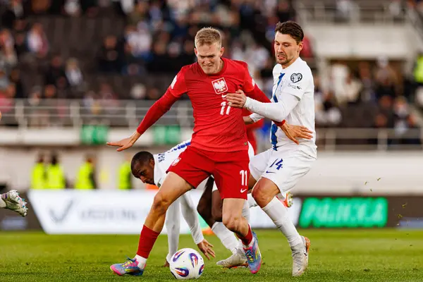 Karol Swiderski ve Kaan Kairinen, 2026 Dünya Kupası 'nda Finlandiya ve Polonya milli takımları arasında oynanan Avrupa ön eleme maçında görüldü (Maciej Rogowski)