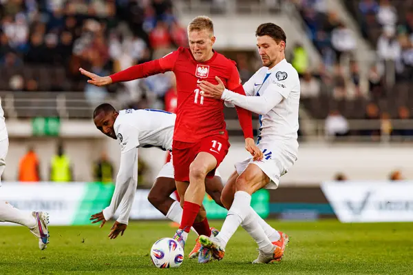 Karol Swiderski ve Kaan Kairinen, 2026 Dünya Kupası 'nda Finlandiya ve Polonya milli takımları arasında oynanan Avrupa ön eleme maçında görüldü (Maciej Rogowski)