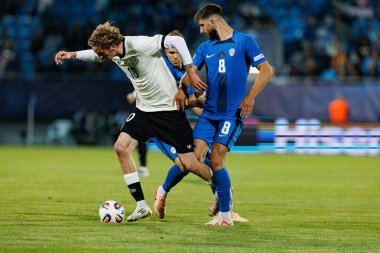 Nick Woltemade ve Adrian Zeljkoviç, Almanya ve Slovenya milli takımları arasında oynanan UEFA U-21 2025 maçında görüldü (Maciej Rogowski)