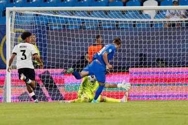 Tio Cipot ve Noah Atubolu, Almanya ve Slovenya milli takımları arasında oynanan UEFA U-21 2025 maçında görüldü (Maciej Rogowski)
