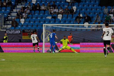 Tio Cipot ve Noah Atubolu, Almanya ve Slovenya milli takımları arasında oynanan UEFA U-21 2025 maçında görüldü (Maciej Rogowski)