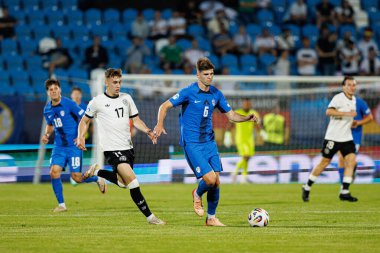 Brajan Gruda ve Zan Jevsenak, Almanya ve Slovenya milli takımları arasında oynanan UEFA U-21 2025 maçında görüldü (Maciej Rogowski)