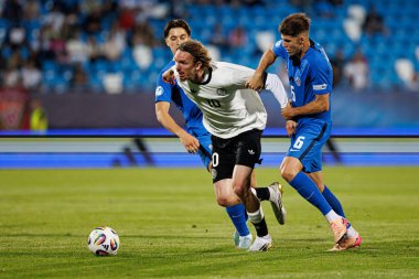 Almanya ve Slovenya milli takımları arasında oynanan UEFA Euro U-21 2025 maçında Enrick Ostrc, Nick Woltemade ve Zan Jevsenak görüldü (Maciej Rogowski)