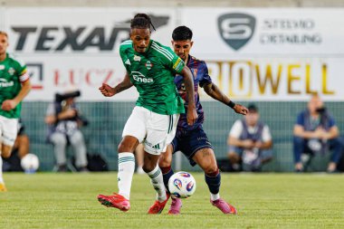 Radomiak Radom ve Pogon Szczecin (Maciej Rogowski) takımları arasındaki PKO BP Ekstraklasa maçı sırasında Vasco Lopes ve Leo Borges)