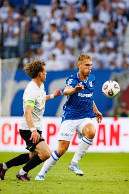 Hoskuldur Gunnlaugsson ve Michal Gurgul UEFA Şampiyonlar Ligi karşılaşmasında görüldüler. Lech Poznan ve Breidablik Kopavogur (Maciej Rogowski)