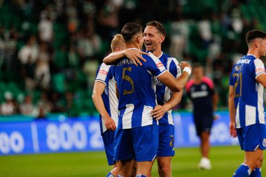 Jan Bednarek ve Luuk De Jong, Liga Portekiz maçında Sporting CP ve FC Porto takımları arasında kutlama yaparken görüldü (Maciej Rogowski / Ball Raw Images)