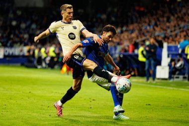 Robert Lewandowski and Lucas Ahijado seen during LaLiga EA SPORTS game between teams of Real Oviedo  and FC Barcelona at Carlos Tartiere Stadium (Maciej Rogowski/Ball Raw Images)