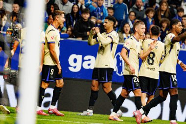 Robert Lewandowski and Ronald Araujo seen celebrating after scoring goal during LaLiga EA SPORTS game between teams of Real Oviedo  and FC Barcelona at Carlos Tartiere Stadium (Maciej Rogowski/Ball Raw Images)