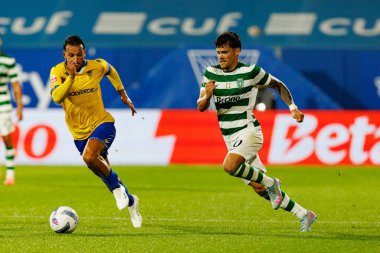 Joao Carvalho and Maximiliano Araujo seen during Liga Portugal game between teams of GD Estoril Praia and Sporting CP at Estadio Antonio Coimbra da Mota (Maciej Rogowski/Ball Raw Images)