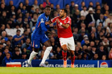 Trevoh Chalobah and Vangelis Pavlidis seen during Champions League league phase game between Chelsea FC and  SL Benfica (Maciej Rogowski/ Ball Raw Images)