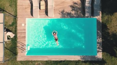 Millennial fit athlete woman making yoga stretching exercises in open air tropical yard on villa Thailand Resort vacation getaway Health care, mental health, wellbeing through meditation. High quality