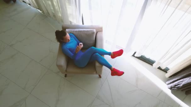 Video Features Woman Sitting Comfortably Chair Large Window Luxurious Villa — Wideo stockowe