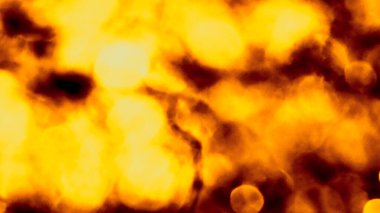 Odaklanamayan sahte ışıklar. Bulanık soyut parıltı dokusu. Arkaplan gece parıldayan altın ışık