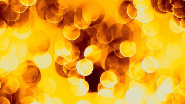 Odaklanamayan sahte ışıklar. Bulanık soyut parıltı dokusu. Arkaplan gece parıldayan altın ışık