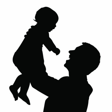 Oğlunu kucağında tutan babanın silueti..