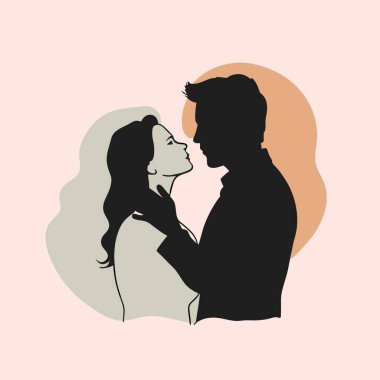 Öpüşen genç aşıkların silueti.