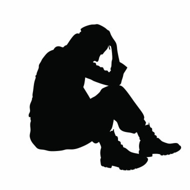 Ellerinde başıyla yerde oturan bir insan.