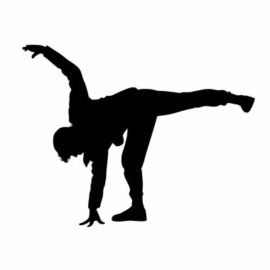 Yoga yapan genç bir kadının silüeti.