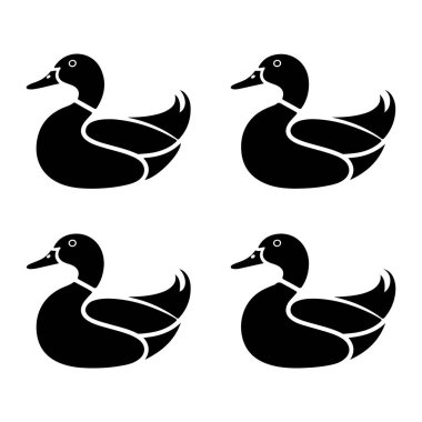 Beyaz arka planda dört şekillendirilmiş siyah ördeğin yer aldığı bir grafik çizimi. Ördekler profilden resmedilmiş, sola dönük, basit, temiz çizgiler ve siluet tarzıyla. Her ördeğin bir gözü için beyaz bir dairesi ve gagası için beyaz bir ovali vardır.. 