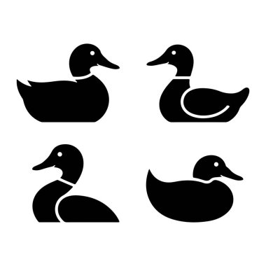 Beyaz arka planda dört adet siyah ördek silueti sergileniyor. Ördekler farklı yönlere bakan, profilden resmedilmiş. İki ördek en üst sırada, iki ördek de en altta. Her ördeğin basit ve yuvarlak bir şekli vardır.