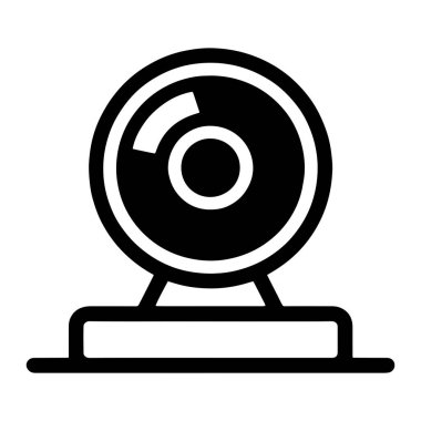 Bir web kamerasının basit bir siyah simgesi temiz beyaz bir arkaplanda görüntülenir. Web kamerası, daha büyük siyah bir dairenin içine çevrili beyaz renkli ve görülebilir bir alanı gösteren dairesel bir mercek içerir. Lens montajı bir rektayla tezgaha monte edilir.