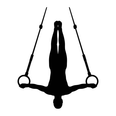 Bir erkek jimnastikçinin siyah silueti jimnastik halkalarında gösterinin ortasında yakalanır. Kollarını yatay olarak uzatarak yüzükleri tutarak baş aşağı asılı duruyor. Vücudu düzgün ve hizalı, gücünü ve kontrolünü gösteriyor. Şey...