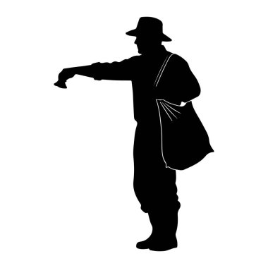 Geniş kenarlı şapka ve çizme giyen siyah bir siluet. Kişi ayakta duruyor ve küçük bir nesne tutan sağ eliyle işaret ediyor gibi görünüyor. Sol omzunun üzerinden büyük bir çanta sarkıyor. Görüntü beyaz renkte izole edilmiştir. 