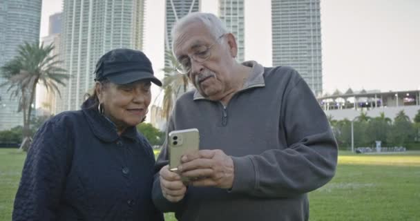 Beautiful Medium Shot Attractive Older Couple Looking Cell Phone While — 图库视频影像