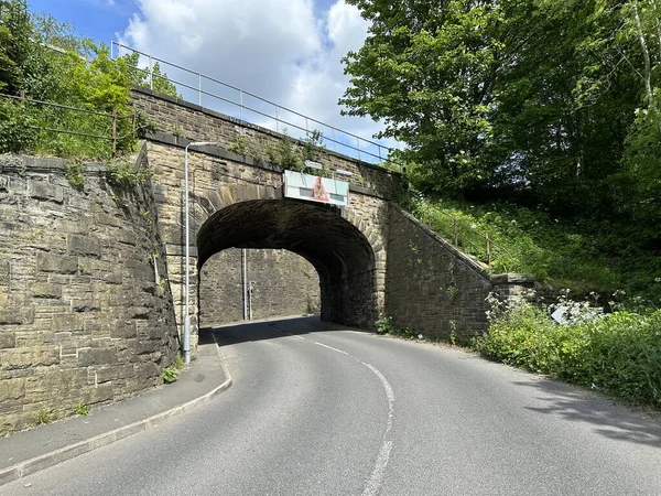 Stock image Victorian stone bridge, with trees and plants nearby on, Halifax Old Road, Hipperholme, Halifax, UK