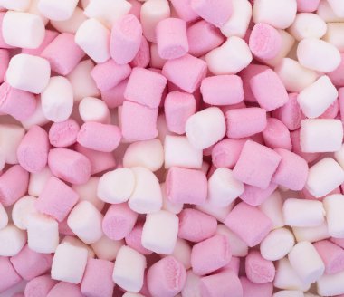 Pink and white marshmallows close up, sweet candy texture background, colorful mini marshmallow dessert pattern for food concep