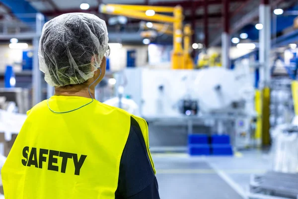 Portrait of safety worker in industrial factory, concet of safety and environment