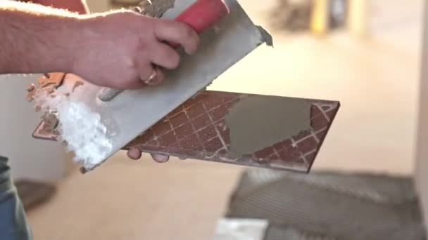 Professional Tiler Applying Adhesive Glue Tile Tiling Floor Industry Building — Stock Video