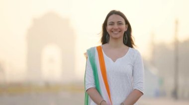 Happy Indian girl in an Indian traditional outfit celebrating Independence day 