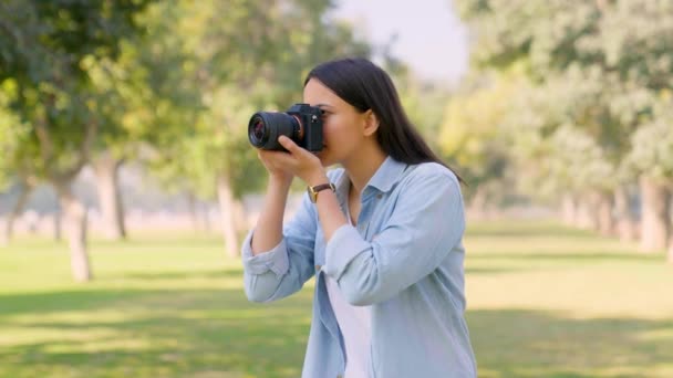 Indian Girl Clicking Photos Nature Using Camera Park — Vídeos de Stock