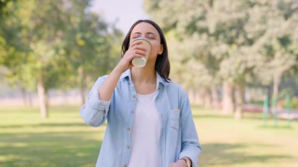Happy Indian Girl Drinking Coffee Enjoying Park Alone — Vídeo de Stock