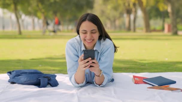 Happy Indian Girl Texting Chatting Somebody Using Her Mobile Phone — Video
