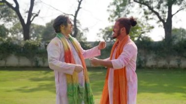 Friends celebrating Holi in an Indian traditional outfit