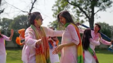 Indian couple dancing in a Holi festival