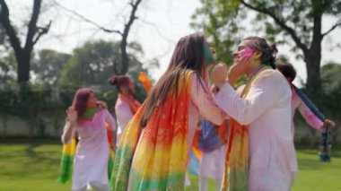 Romantic Indian couple celebrating Holi festival