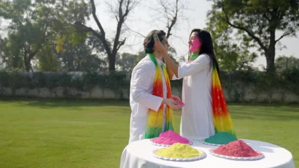 Happy Indian Couple Putting Holi Colors Each Other Face — Stok video