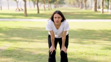Tired and exhausted Indian woman in a park in morning