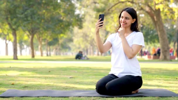 Indian Yoga Girl Taking Selfies Using Her Mobile Phone Park — Stok Video