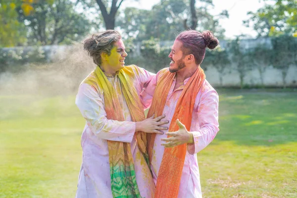 Indian men celebrating Holi festival