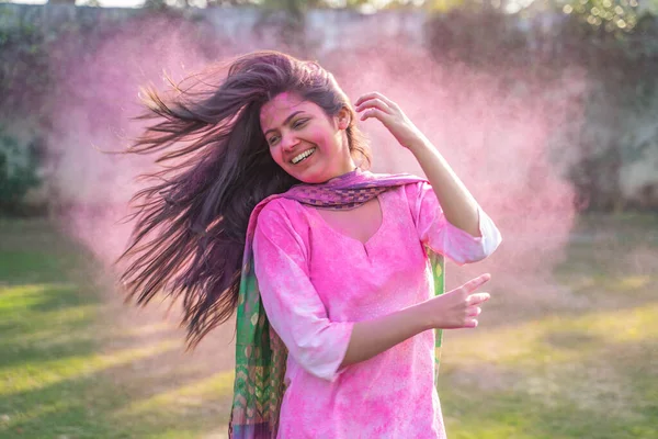 Indian girl enjoying Holi festival